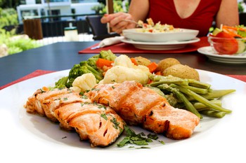 Grilled Salmon served with Roasted Potatoes and Sautéed seasonal Vegetables